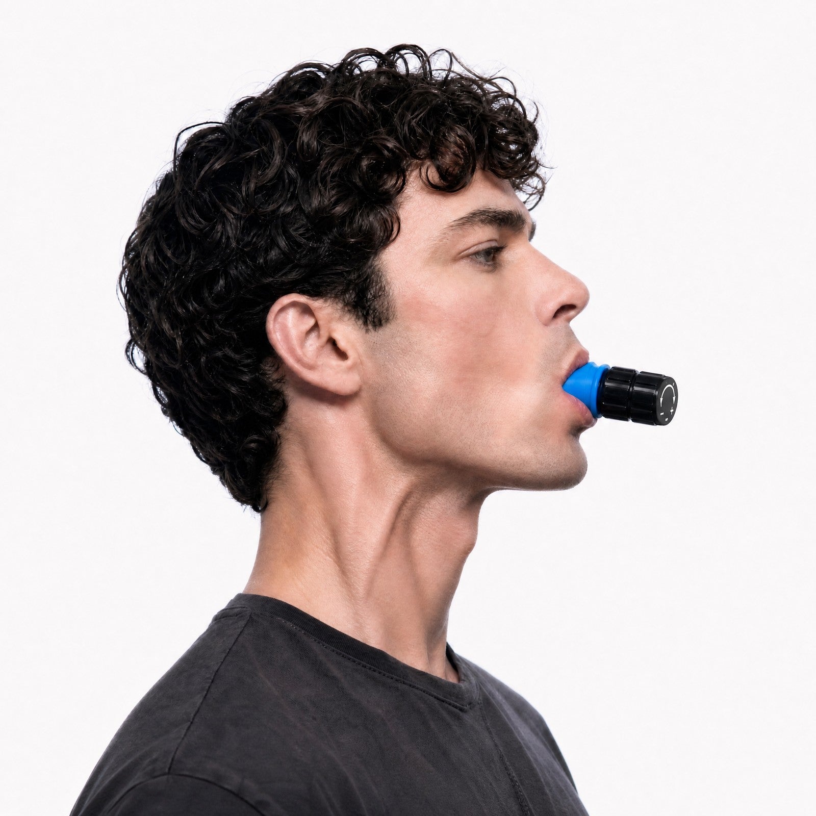 HYOIDR jawline trainer in use, side profile, inhaling against resistance with the neck muscles visibly engaged